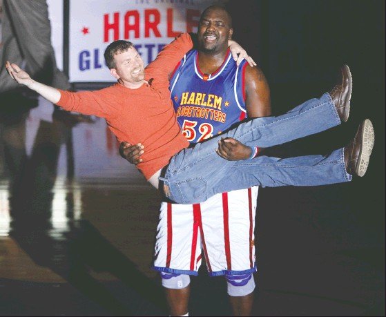 Return: Kevin Smith gets a dance from Big Easy of the Harlem Globetrotters during a performance at Wildcat Arena. The Globetrotters return to El Dorado today.