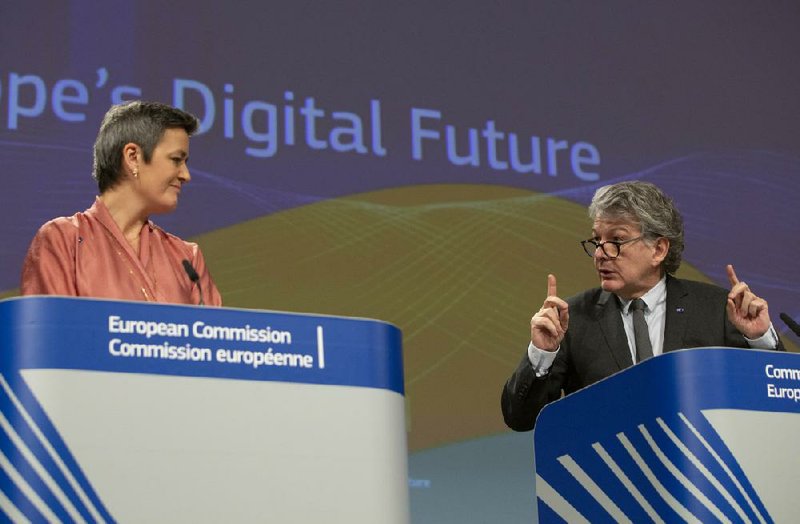 European Commission officials Margrethe Vestager (left) and Thierry Breton participate in a presentation Wednesday in Brussels regarding an initiative to help Europe compete technologically.
(AP/Virginia Mayo)