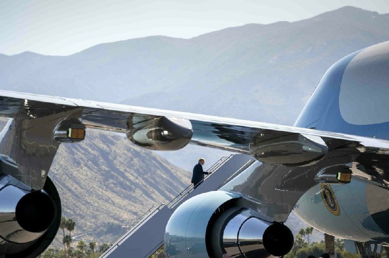 President Donald Trump boards Air Force One at the airport in Palm Springs, Calif., on Wednesday after a fundraiser. Trump renewed his public criticism of the Justice Department as he made a series of stops in the western United States.
(The New York Times/Doug Mills)