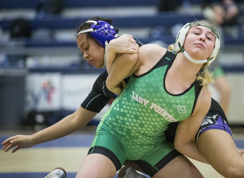 (NWA Democrat-Gazette/Ben Goff) Sophomore Mayte Rodriguez (in purple) of Fayetteville will take a perfect 24-0 record into today's inaugural Arkansas High School Girls Wrestling Tournament to be held in the Stephens Center on the campus of Arkansas-Little Rock.