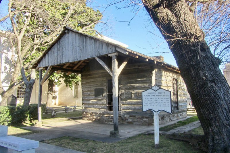 Albert Pike Schoolhouse, on the lawn of Crawford County Courthouse, dates to the 1830s at a previous location near Van Buren.

(Special to the Democrat-Gazette/Marcia Schnedler)