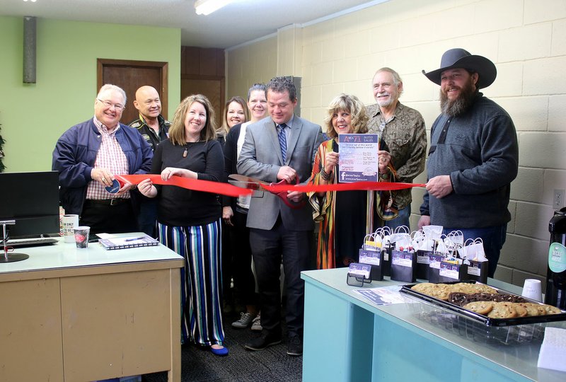 MEGAN DAVIS/MCDONALD COUNTY PRESS On Tuesday, Feb. 18, members of the McDonald County Chamber of Commerce gathered to celebrate as Shannon and Charla Brewer celebrated a ribbon-cutting at Area 71 Auto Sales in Anderson.