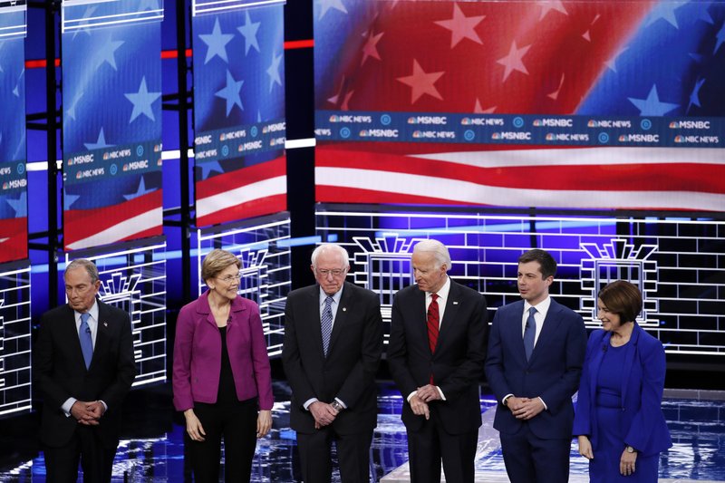 From left, Democratic presidential candidates, former New York City Mayor Michael Bloomberg, Sen. Elizabeth Warren, D-Mass., Sen. Bernie Sanders, I-Vt., former Vice President Joe Biden, former South Bend Mayor Pete Buttigieg and Sen. Amy Klobuchar, D-Minn., stand on stage before a Democratic presidential primary debate Wednesday in Las Vegas hosted by NBC News and MSNBC. - AP Photo/John Locher