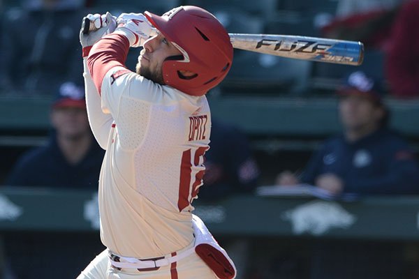 Arkansas catcher Casey Opitz doubles to center field Thursday, Feb. 20, 2020, during the third inning against Gonzaga at Baum-Walker Stadium. 