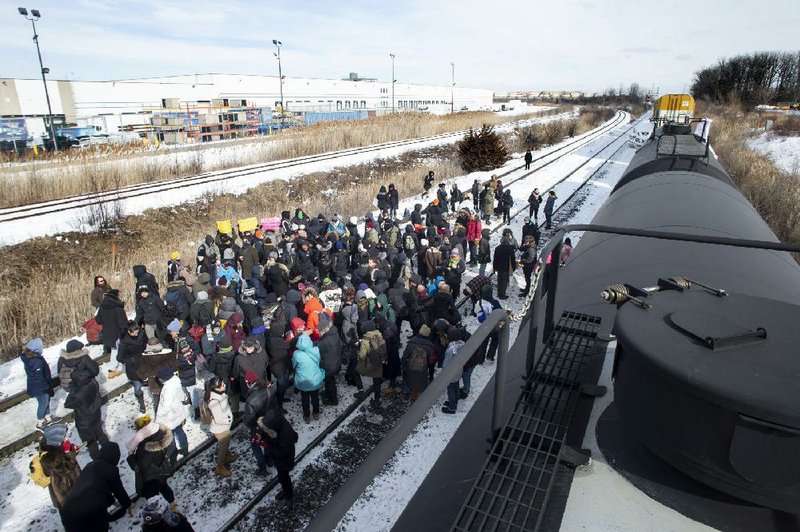 Protesters blockade the tracks earlier this month at a Canadian National Railway Co. rail yard in Toronto.
(AP)