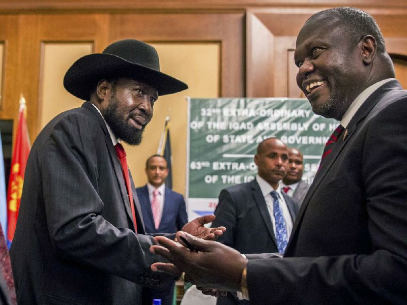 South Sudan President Salva Kiir (left) and opposition leader Riek Machar are shown at peace talks in June 2018 in Addis Ababa, Ethiopia. On Thursday, they announced agreement on a power-sharing coalition.
(AP/Mulugeta Ayene)