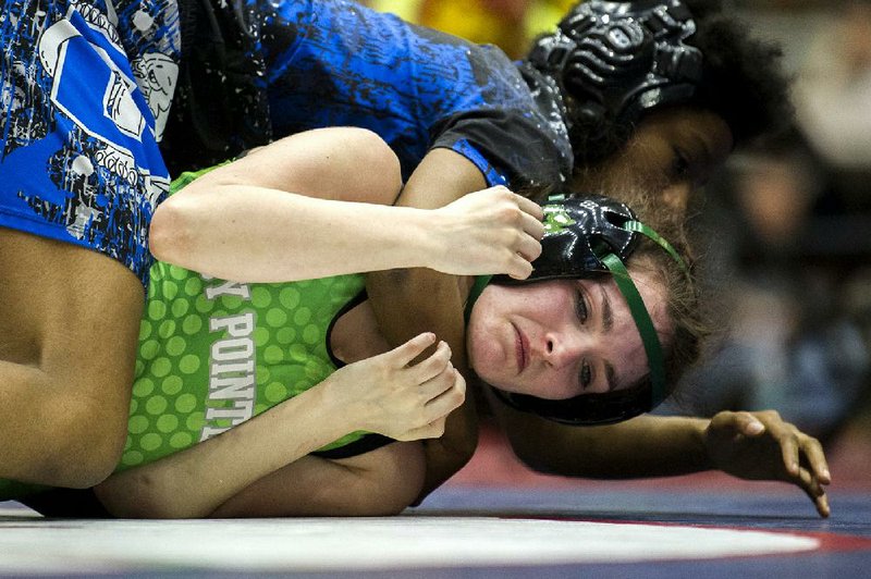 Van Buren’s Violet Summers (bottom) attempts to get away from Conway’s Abigail Crawford during the 100-pound championship match. Summers was awarded the title after Crawford was disqualified.
(Arkansas Democrat-Gazette/Stephen Swofford)