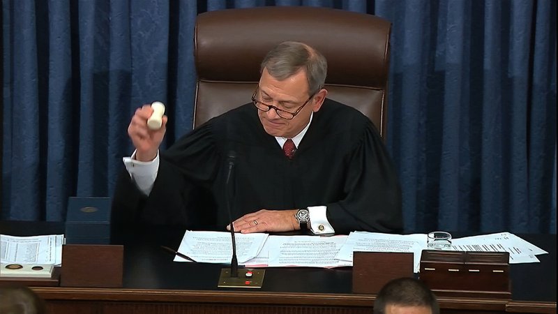 In this image from video, presiding officer Chief Justice of the United States John Roberts gavels the impeachment trial against President Donald Trump to an end in the Senate at the U.S. Capitol in Washington, Wednesday, Feb. 5, 2020. The U.S. Senate has acquitted Trump, ending only the third presidential trial in American history. (Senate Television via AP)