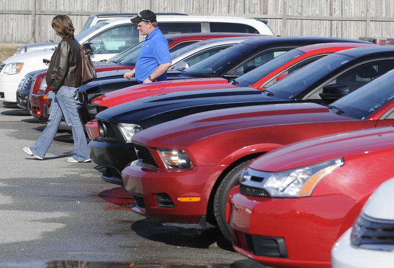 Shoppers look at used car Wednesday, Jan. 11, 2012, at Landers McLarty in Bentonville. 
(NWA Democrat-Gazette/FILE PHOTO)