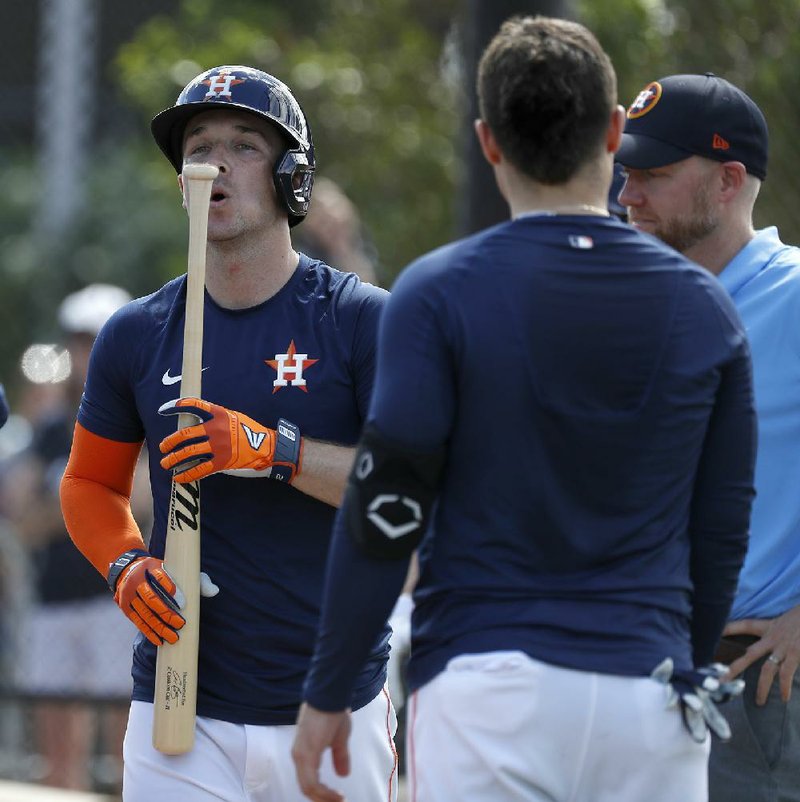 Houston Astros infielder Alex Bregman blows on his bat after batting practice earlier this week in West Palm Beach, Fla. The Astros play the Washington Nationals in a spring training game tonight, their first meeting since last year’s World Series. Since then, Houston’s reputation has become tarnished by an offseason sign-stealing scandal.
(AP/Houston Chronicle/Karen Warren)