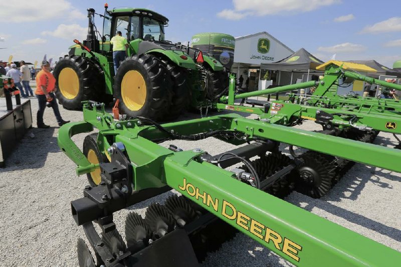 John Deere tractors are on display at a farm trade show last year in Grand Island, Neb. As the U.S. agriculture industry feels the effects of the trade war with China, more than half of U.S. farmers plan to spend less on capital equipment this year, according to a survey.
(AP/Nati Harnik)