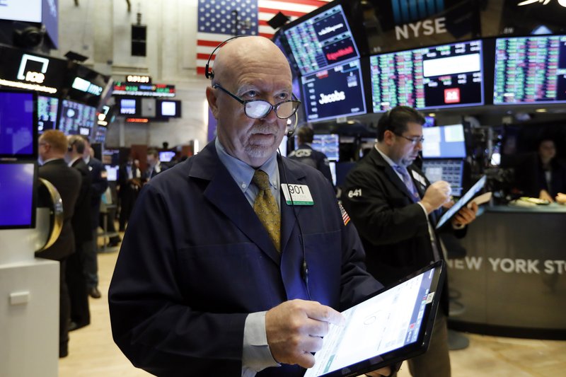 FILE - In this Feb. 6, 2020, file photo trader John Doyle works on the floor of the New York Stock Exchange. (AP Photo/Richard Drew, File)