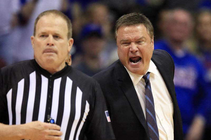 Kansas head coach Bill Self, right, yells at referee Gerry Pollard, left, during the second half of an NCAA college basketball game against Oklahoma in Lawrence, Kan., Saturday, Feb. 15, 2020. Kansas defeated Oklahoma 87-70. (AP Photo/Orlin Wagner)