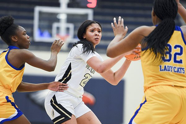 Nettleton guard Elauna Eaton (23) looks to pass during a game against North Little Rock on Thursday, Dec. 7, 2019, during the Great 8 girls basketball tournament at Rogers Heritage High School in Rogers. 