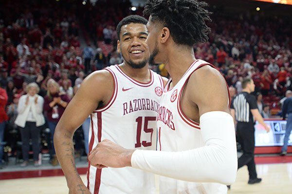 Arkansas guard Isaiah Joe (right) celebrates Saturday, Feb. 22, 2020, with Mason Jones after the Hogs' 78-68 win over Missouri in Bud Walton Arena in Fayetteville.
