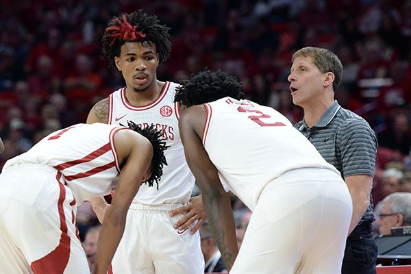 Arkansas guard Desi Sills (left facing) and coach Eric Musselman (right facing) are shown during a game against Missouri on Saturday, Feb. 22, 2020, in Fayetteville. 