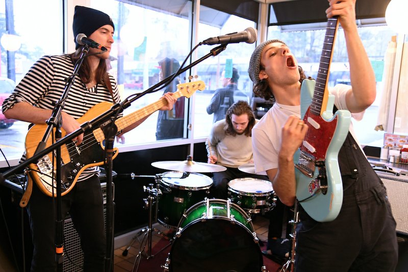 Greg Coffey, left, Kyle Conlon and Ryan "Zuli" Camenzuli of the New York-based band Zuli perform a set inside Waffle House as part of the Valley of the Vapors Independent Music Festival on March 18, 2018. - Photo by Grace Brown of The Sentinel-Record