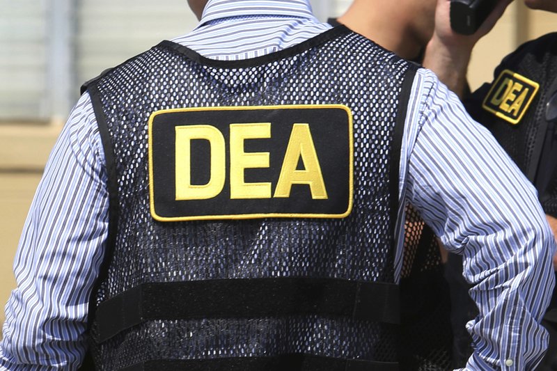 This June 13, 2016, file photo shows Drug Enforcement Administration (DEA) agents in Florida. On Friday, the FBI arrested U.S. federal narcotics agent Jose Irizarry and his wife, Nathalia Gomez Irizarry, at their residence in Puerto Rico, according to a law enforcement official familiar with the arrest. He has been charged with conspiring to launder money with the very same Colombian drug cartels he was supposed to be fighting. - Joe Burbank/Orlando Sentinel via AP
