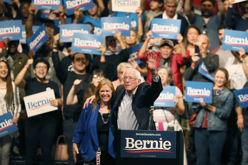 Democratic presidential candidate Sen. Bernie Sanders, I-Vt., with his wife Jane O'Meara Sanders, waves his hand during a rally in El Paso, Texas, on Saturday. - Briana Sanchez/The El Paso Times via AP