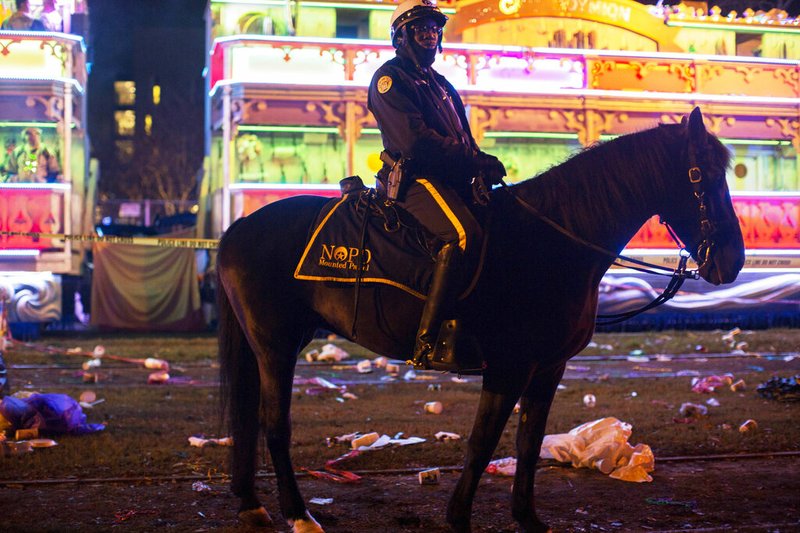 A police officer works the scene where a man was reportedly hit and killed by a float of the Krewe of Endymion parade in the runup to Mardi Gras in New Orleans, Saturday, Feb. 22, 2020.
