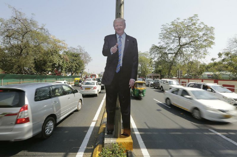 A life-size cutout of President Donald Trump is displayed on a road divider Saturday ahead of Trump’s visit to Ahmedabad, India.
(AP/Ajit Solanki)