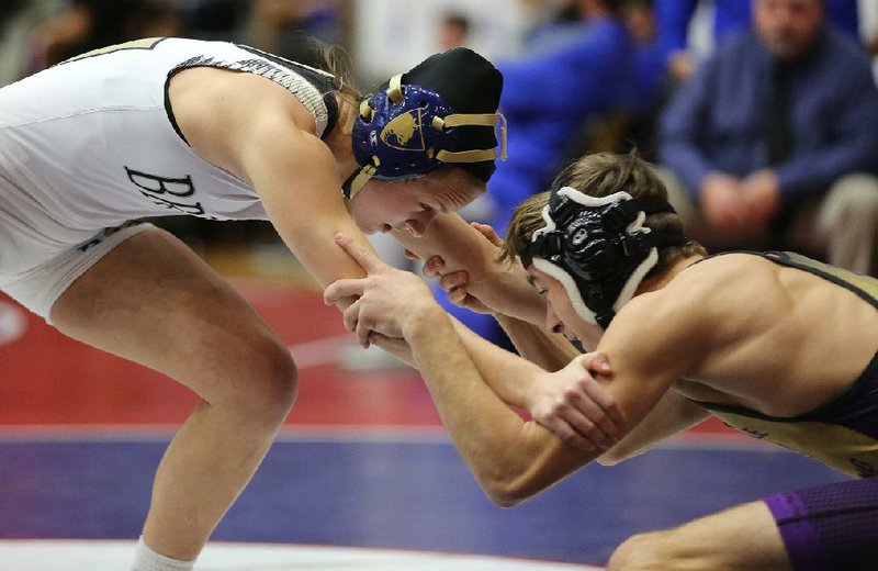 Pulaski Academy’s Riley Holman defeated Berryville’s Dominic Henry to win the Class 1A-4A, 120 pound championship during the high school state wrestling tournament Saturday at the Jack Stephens Center in Little Rock.
(Arkansas Democrat-Gazette/Thomas Metthe)