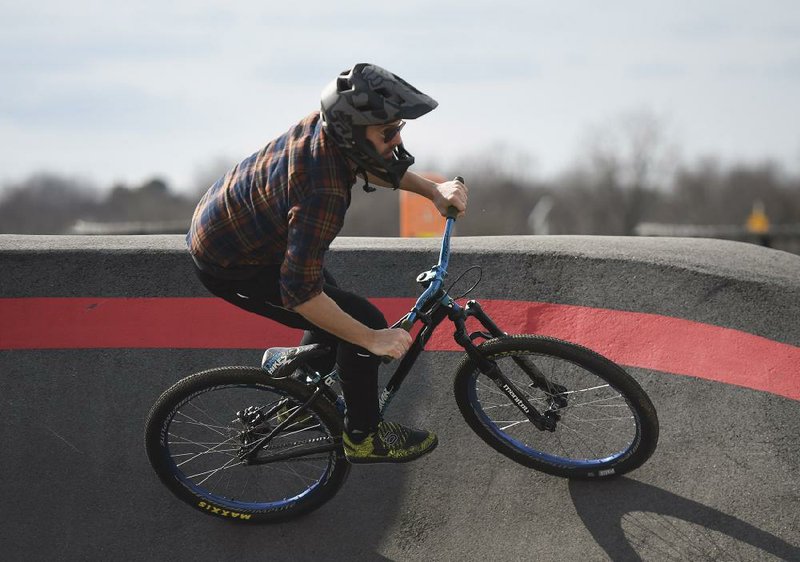 Zach Springer, 34, of Bentonville practices riding for the Red Bull Pump Track World Championship qualifier on Jan. 26 at the Runway Bike Park in Springdale. The qualifier is April 25. More photos at arkansasonline.com/223bikes/.
(NWA Democrat-Gazette/Charlie Kaijo)