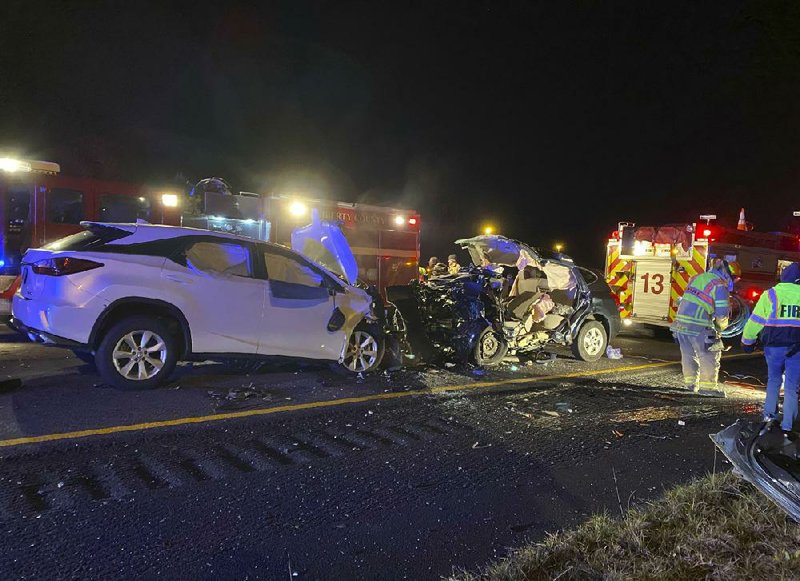 Midway, Ga., firefighters work at an accident early Sunday that killed several people on Interstate 95 in Liberty County. (AP Photo/Lewis Levine) 