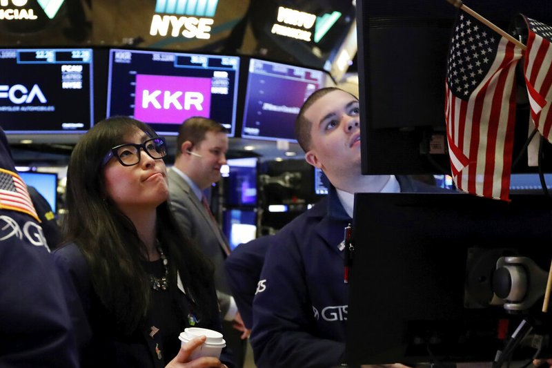 FILE - In this Feb. 24, 2020, file photo specialist Erica Fredrickson works with a colleague on the floor of the New York Stock Exchange. The U.S. stock market opens at 9:30 a.m. EST on Tuesday, Feb. 25. (AP Photo/Richard Drew, File)