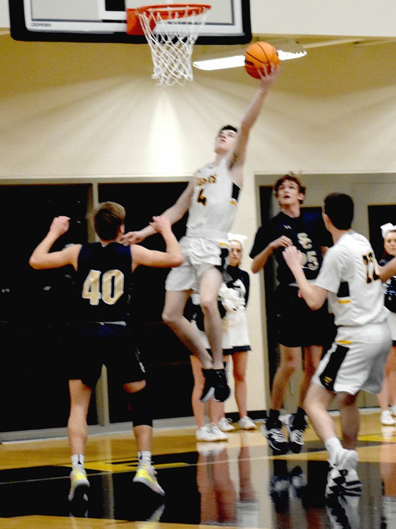 MARK HUMPHREY ENTERPRISE-LEADER Prairie Grove senior Noah Ceniceros scored 22 points to lead the Tigers past Shiloh Christian, 59-32, in the District 4A-1 boys basketball consolation game Saturday. Prairie Grove claimed third place and takes on No. 2 seed Pottsville out of the 4A-4 Thursday at 8:30 p.m. at the Regional tournament at Berryville's Bobcat Arena.