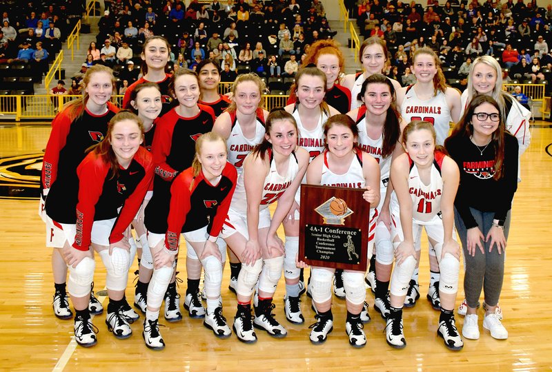 MARK HUMPHREY ENTERPRISE-LEADER The Farmington girls basketball team poses with their newly-won District 4A-1 championship trophy Saturday. The Lady Cardinals defeated Harrison in the finals, 54-41; after beating Pea Ridge, 56-39, in the semifinals Thursday at Prairie Grove. This week Farmington takes on Pottsville Wednesday at 7 p.m. in a first-round Regional game at Berryville's Bobcat Arena.