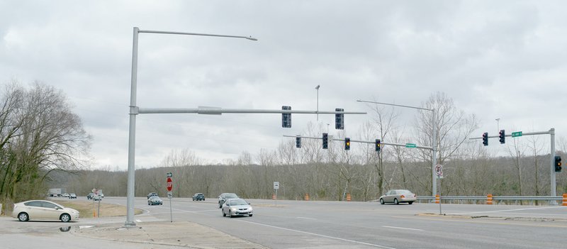 Keith Bryant/The Weekly Vista The freshly-installed traffic signal at U.S. Highway 71 and Kingsland Road flashes on a gloomy Monday morning before the timing is set and the light starts directing traffic.