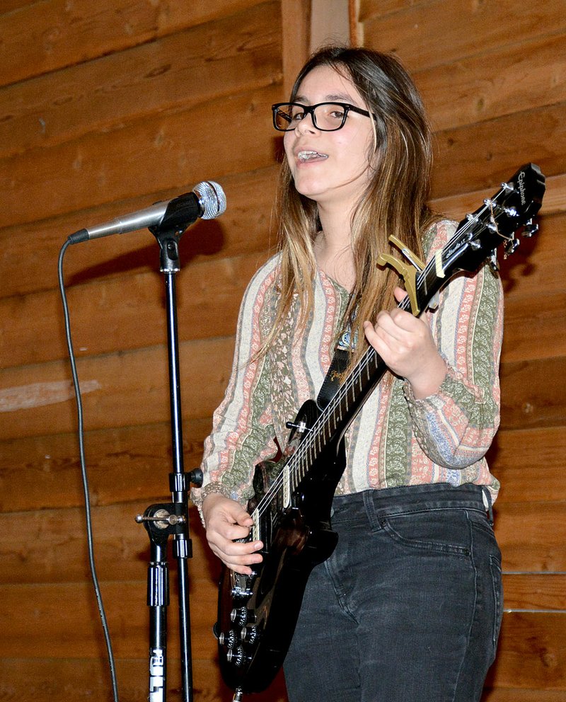 Janelle Jessen/Herald-Leader Elviana Reynoso performed during the Boys &amp; Girls Club of Western Benton County banquet on Feb. 18. Reynoso is chosen to perform at the national Boys &amp; Girls Club conference in Orlando, Fla., this May. She was also named junior youth of the year for the Siloam Springs site during the event.
