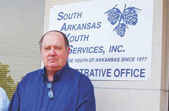 An Aug. 19, 2014, Banner-News file photo shows Jerry Walsh, then executive director of South Arkansas Youth Services, in front of the now-bankruptcy nonprofit’s former administrative offices on N. Washington St. in Magnolia.
