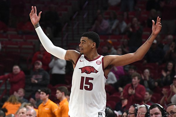 Arkansas' Mason Jones motions to the crowd during the closing minutes of the Razorbacks' 86-69 victory over Tennessee on Wednesday, Feb. 26, 2020, in Fayetteville. 