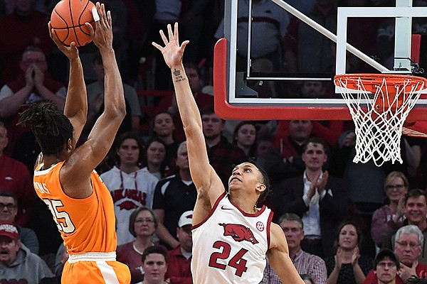 Arkansas' Ethan Henderson (24) tries to block a shot by Tennessee's Yves Pons during a game Wednesday, Feb. 26, 2020, in Fayetteville. Arkansas' Ethan Henderson (24) tries to block a shot by Tennessee's Yves Pons during a game Wednesday, Feb. 26, 2020, in Fayetteville.