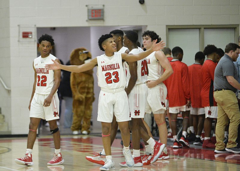 Magnolia G Colby Garland (23) fires up the crowd after halftime at Magnolia's final regular-season home game on Feb. 18, 2020. 