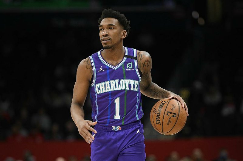 Charlotte Hornets guard Malik Monk (1) dribbles the ball during the first half of an NBA basketball game against the Washington Wizards, Thursday, Jan. 30, 2020, in Washington. (AP Photo/Nick Wass)