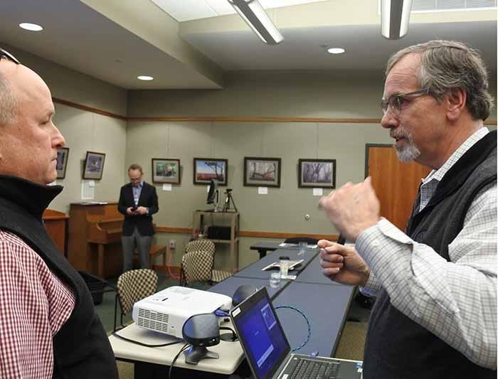 In this file photo Fort Smith Ward 1 Director Keith Lau (left) speaks with James Arbuckle of Halff Associates Inc. after the Fort Smith Board of Directors study session. Newcomer Jarred Rego has filed for the Ward 1 position currently occupied by Keith Lau.
(Arkansas Democrat-Gazette/Thomas Saccente)