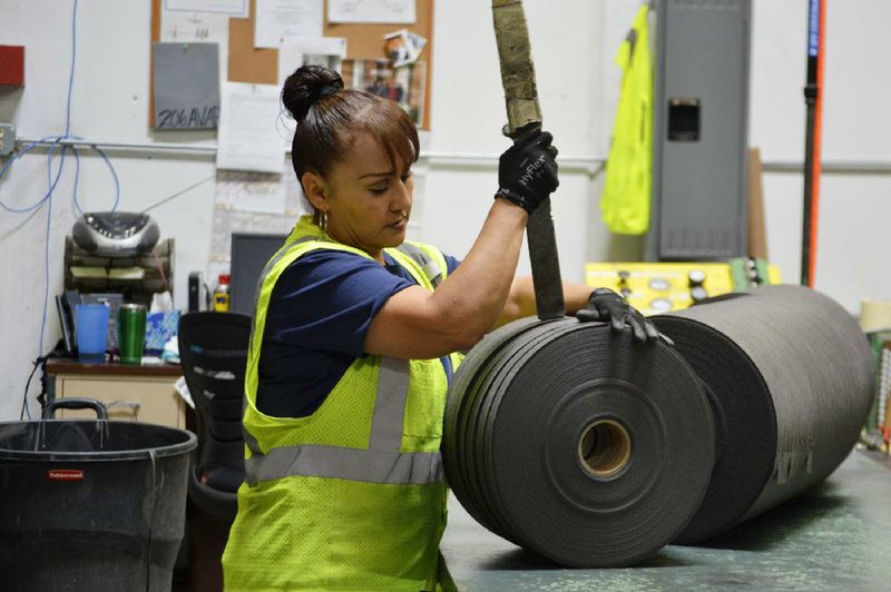 An Acme Mills employee works in 2018 in Santa Teresa, N.M. Border trade leaders say they are  optimistic about the 2020 trade forecast with Mexico, especially at the Santa Teresa Port of Entry in New Mexico.
(AP/Russell Contreras)