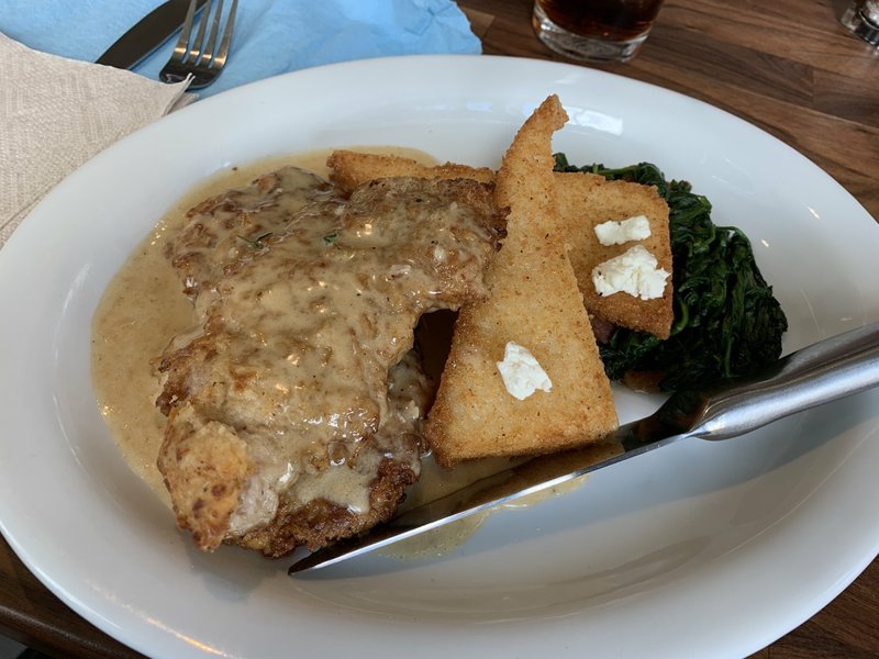 Hog and Cake -- breaded, pan-fried pork tenderloin medallions with pan gravy, grit cakes and sauteed spinach -- is one of three entrees at Hill Station on Kavanaugh Boulevard.

(Arkansas Democrat-Gazette/Eric E. Harrison)