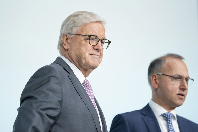 Werner Wenning, chairman of Bayer, left, stands with Werner Baumann, chief executive officer of Bayer, as they arrive for the company's annual general meeting in Bonn, Germany, on April 26, 2019. 
(Bloomberg photo by Jasper Juinen)