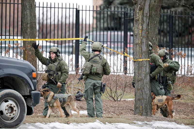 Police work near the Molson Coors Brewing Co. in Milwaukee, where a gunman killed multiple people Wednesday. More photos at arkansasonline.com/227milwaukee/
(AP/Morry Gash)