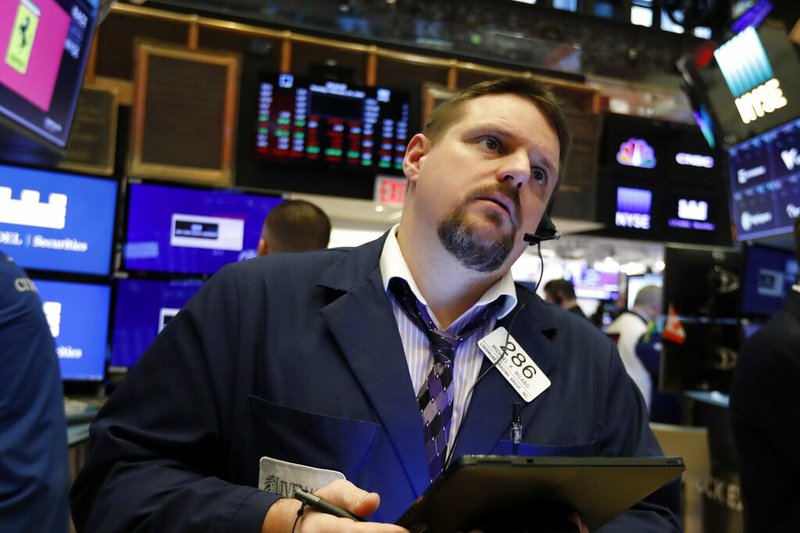 In this Feb. 24, 2020, file photo trader Michael Milano works on the floor of the New York Stock Exchange. The U.S. stock market opens at 9:30 a.m. EST on Thursday, Feb. 27. (AP Photo/Richard Drew, File)