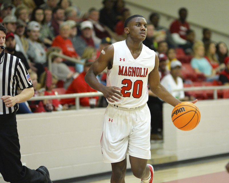 Derrian Ford (20) is seen in a Feb. 18, 2020, home game in Panther Arena. The sophomore guard on Wednesday night led Magnolia with 24 points in a win over Buaxite in the regional boys basketball tournament. The team has now punched its ticket to the Class 4A State Tournament. 