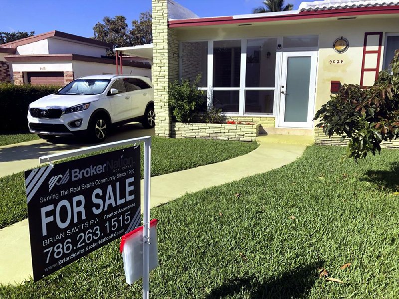 Contract signings for existing U.S. homes rose in January after slumping in December.
(AP/Wilfredo Lee)