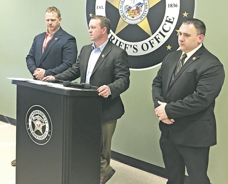 Maj. Kenneth Paul (from left), Sheriff Shawn Holloway and Capt. Thomas See, speak to the media Thursday at the Benton County Sheriff's Office in Bentonville about the arrest of four people in connection with a homicide. (NWA Democrat-Gazette/Mike Jones).