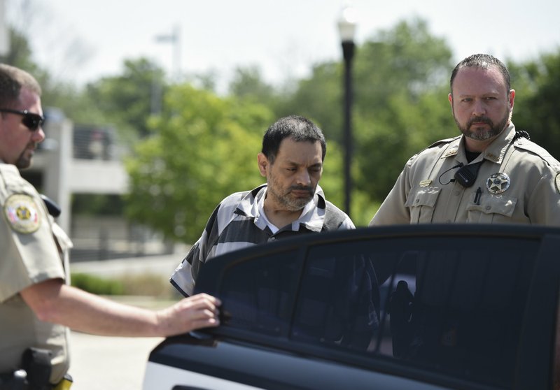 Mauricio Torres is escorted out of the Benton County Courthouse Annex June 21 in Bentonville. Testimony in second capital murder trial in the death of his 6-year-old son began Thursday. (File photo/NWA Democrat-Gazette/Charlie Kaijo)