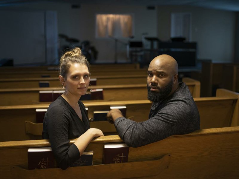 Pastor Noah Tillman-Young, 34, and his wife and fellow pastor, Allison Tillman-Young, 35, sit in the main worship hall at Joyful Heart Church in Stockdale, Texas. After the fatal church shooting in nearby Sutherland Springs in 2017, members of Joyful Heart volunteered to carry concealed handguns during services.
(The Washington Post/Matthew Busch)