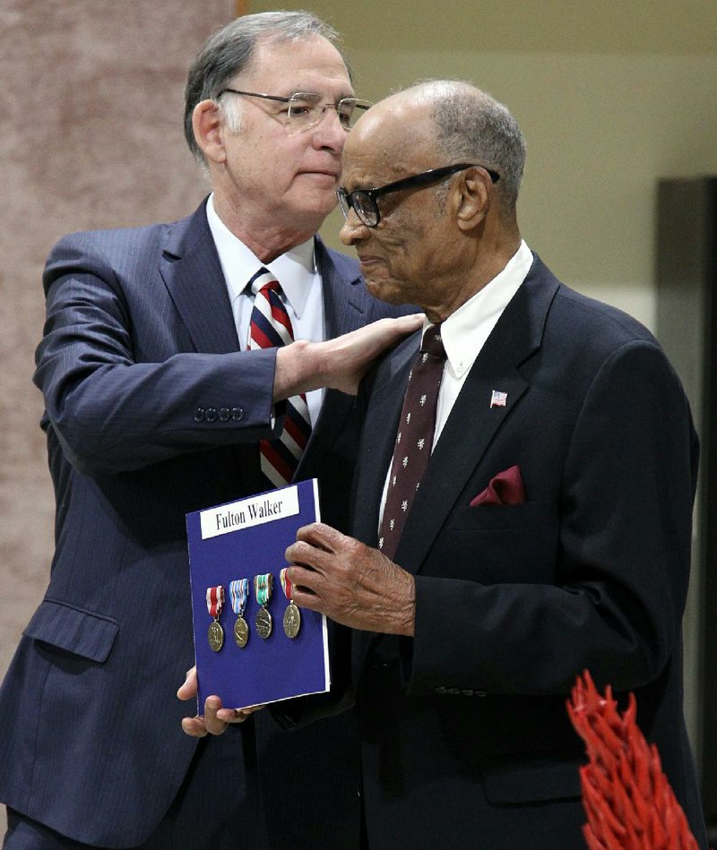 Fulton Walker (right) talks with U.S. Sen. John Boozman during a ceremony Friday in Pine Bluff where Walker was presented with the World War II service medals he never received.
(Arkansas Democrat-Gazette/Dale Ellis)
